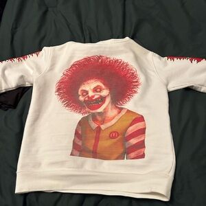 White Sweatshirt with Red Clown Graphic